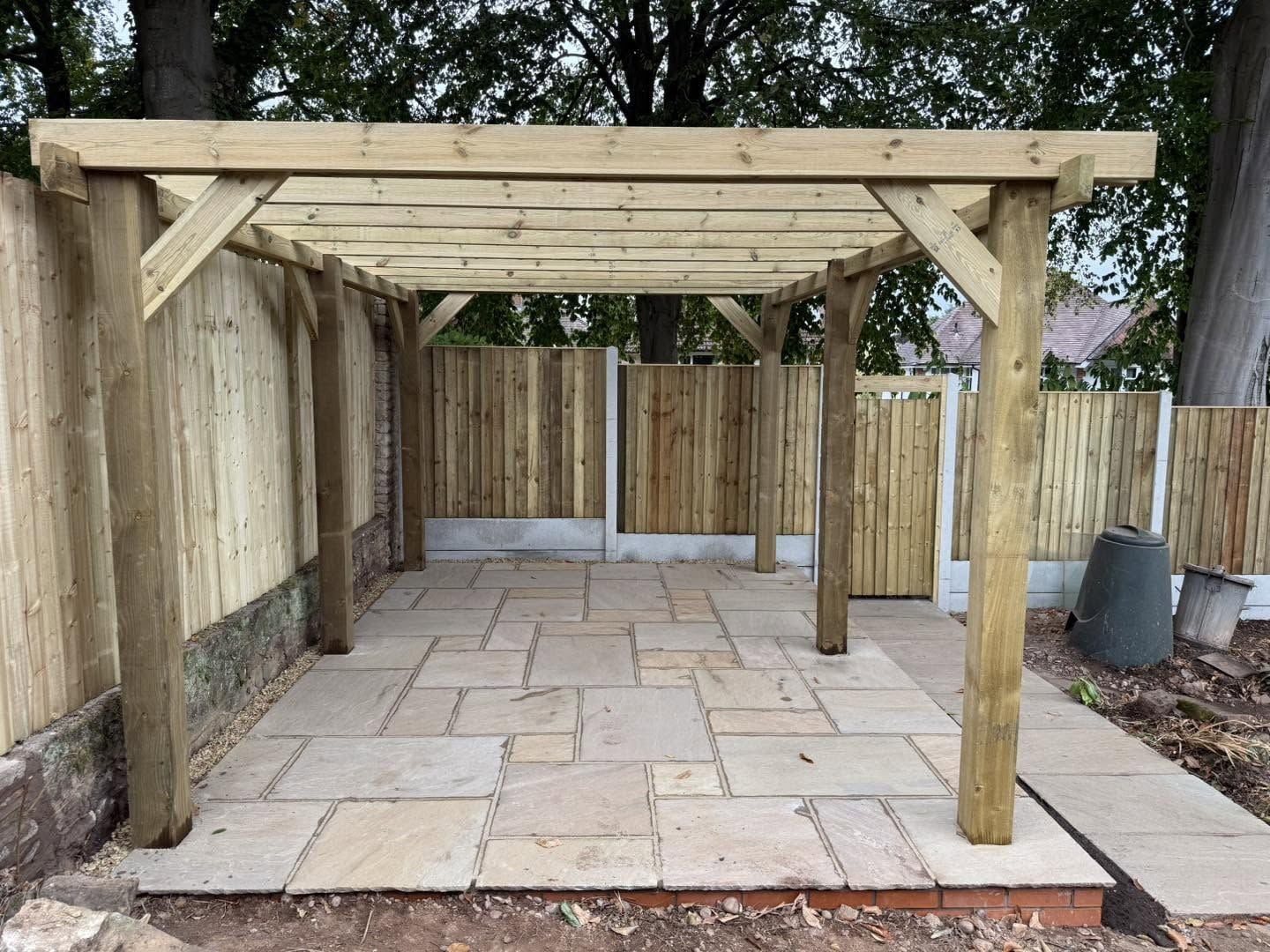 Raised sandstone patio with timber pergola, Barnt Green