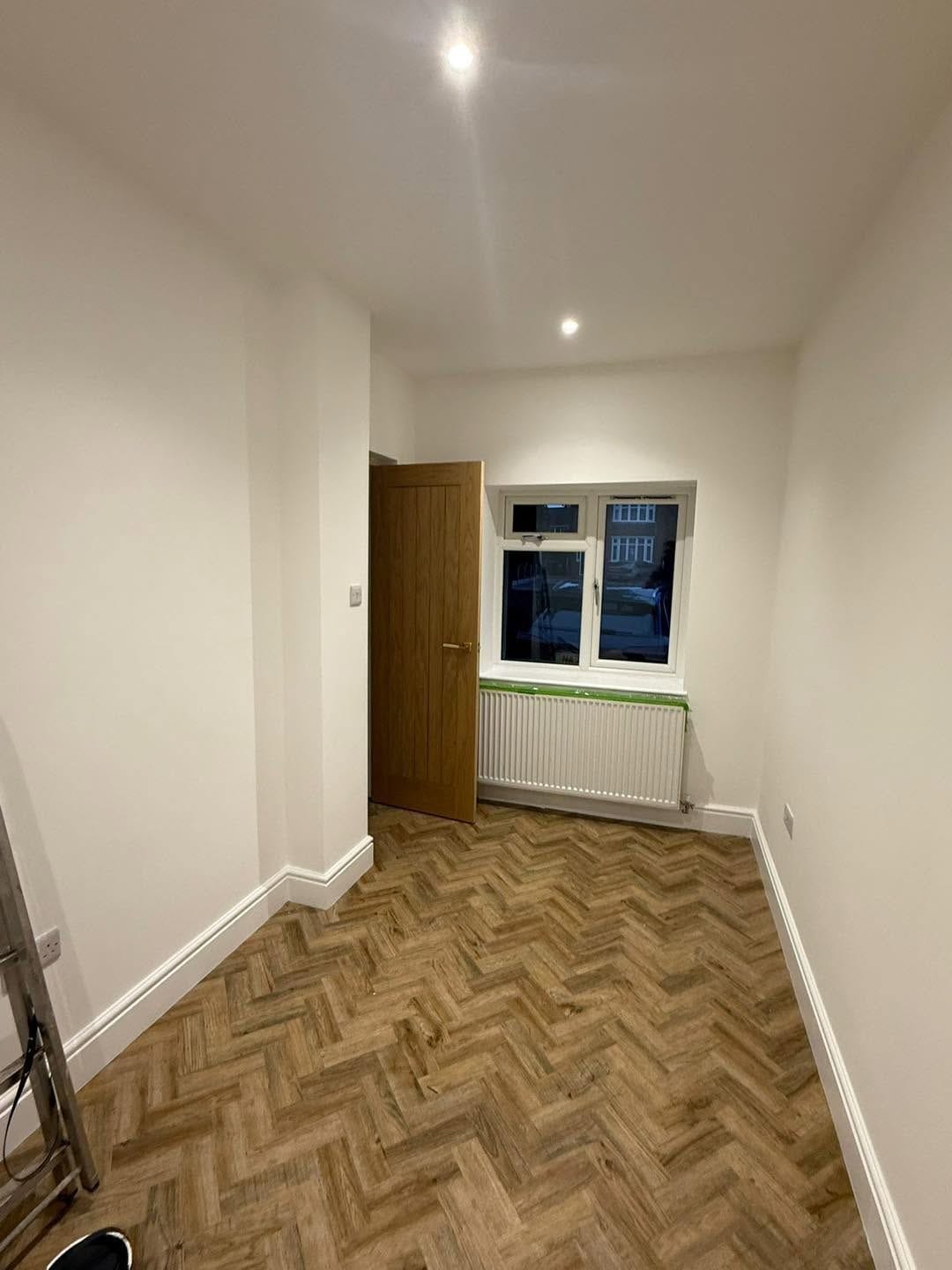 New room with window and herringbone floor, Birmingham