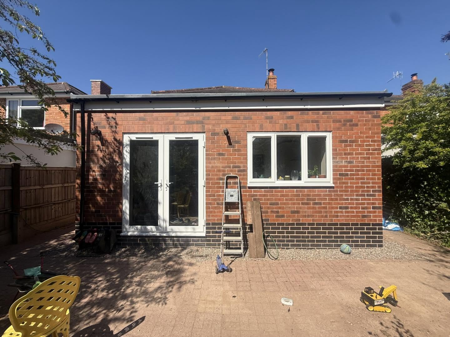 Finished kitchen extension with skylights and French doors to garden