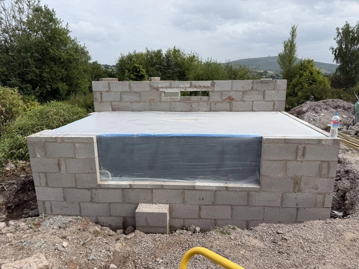 Pond surround blockwork with viewing window, Clee Hill