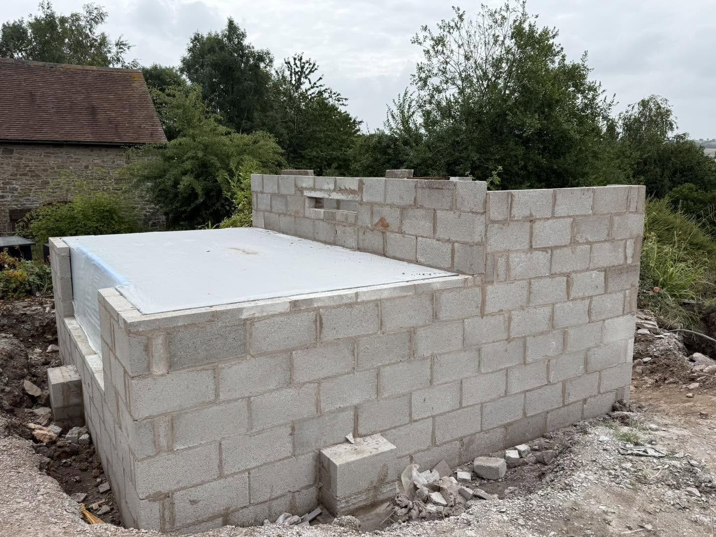Pond and pump house blockwork, Clee Hill