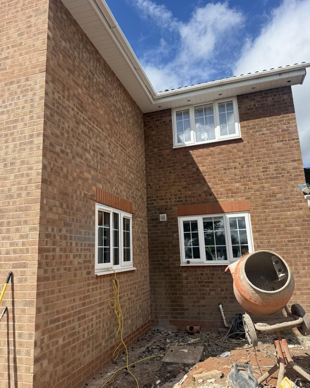 Side extension brickwork with new windows fitted, Droitwich