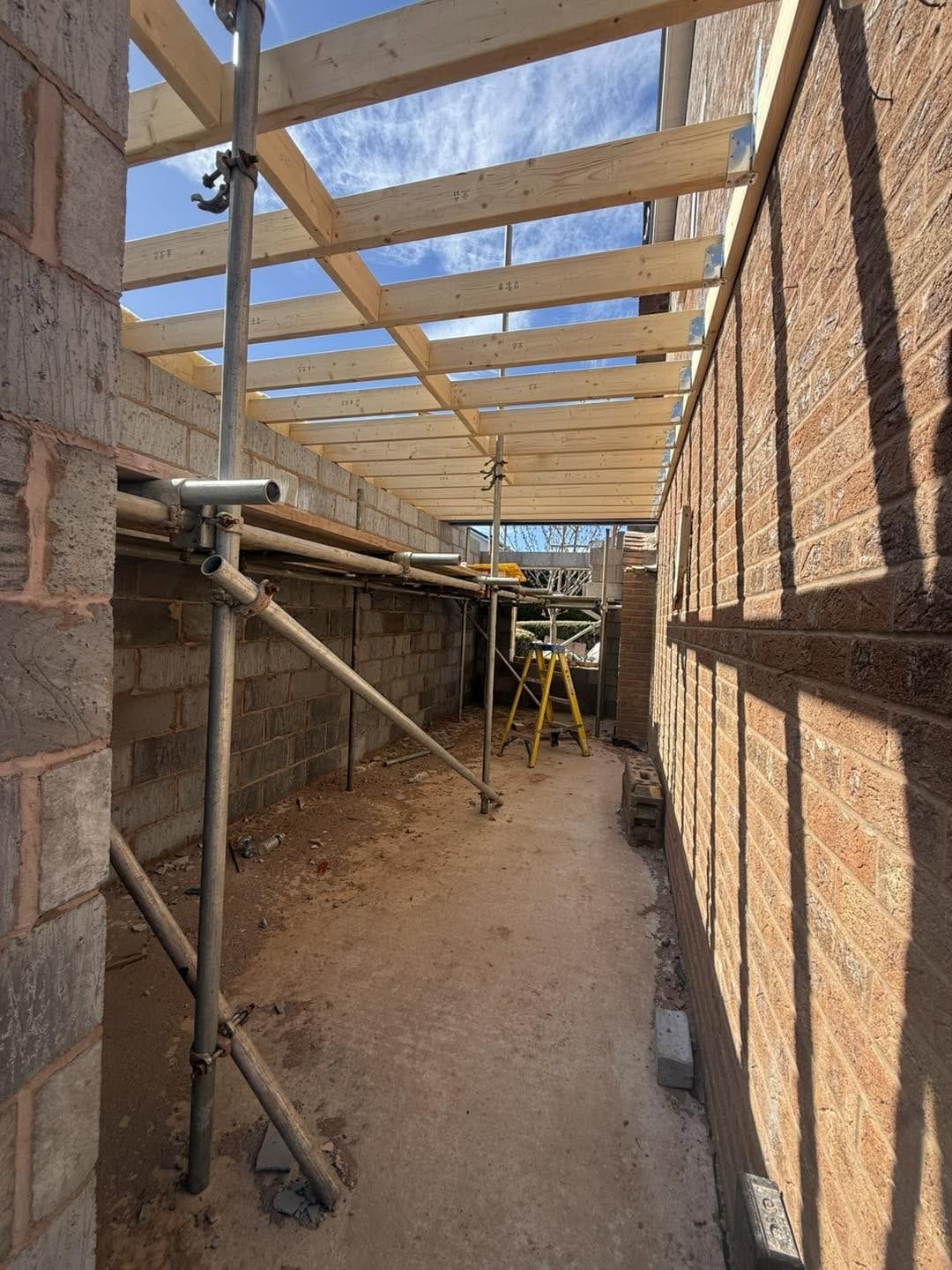 Side extension walls up to first-floor level with joists going in, Droitwich