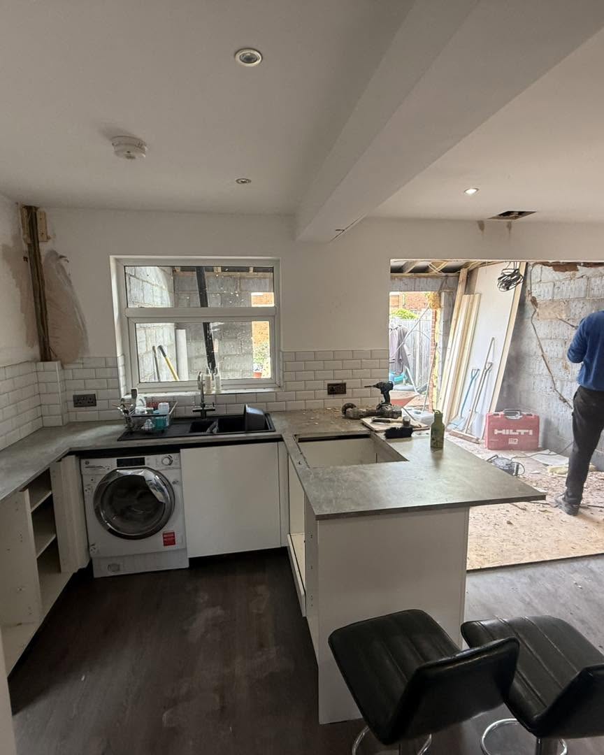 New kitchen units fitted with bespoke island in the open-plan extension