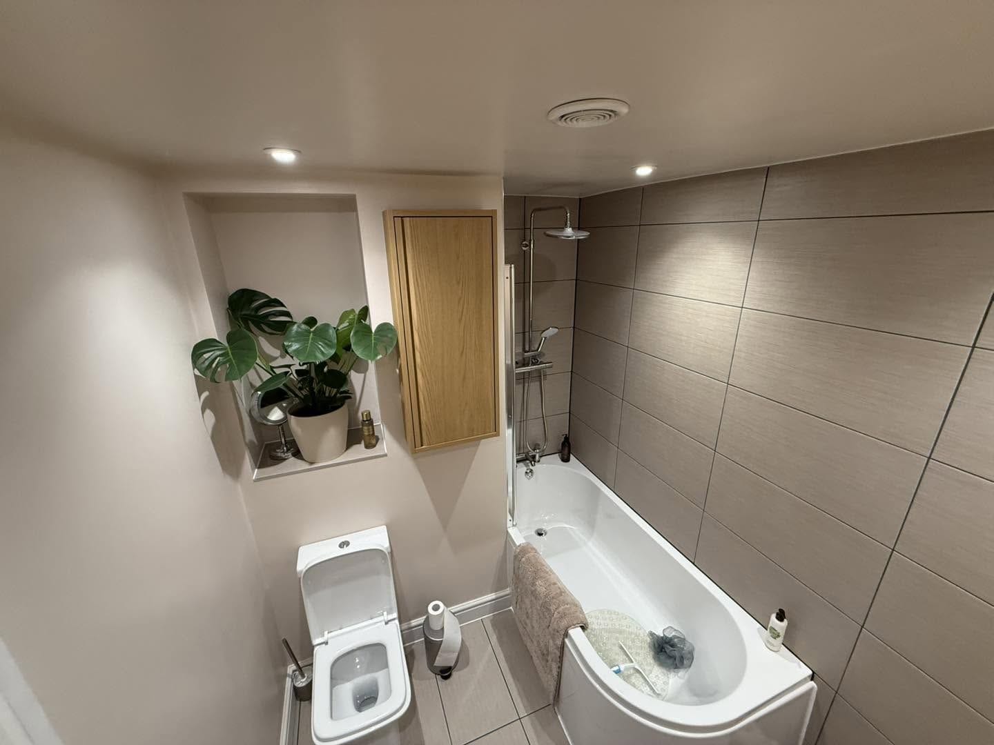 Bathroom with bath and shower