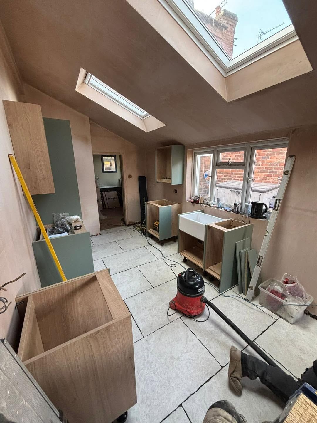 Kitchen units being fitted under the roof windows, Kidderminster