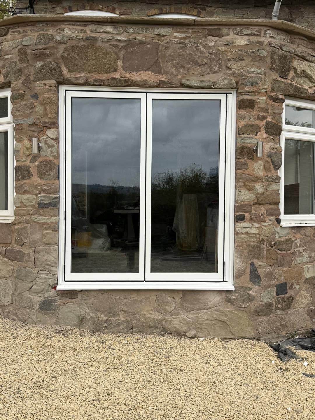 Sun room with new doors, outside view, Ludlow