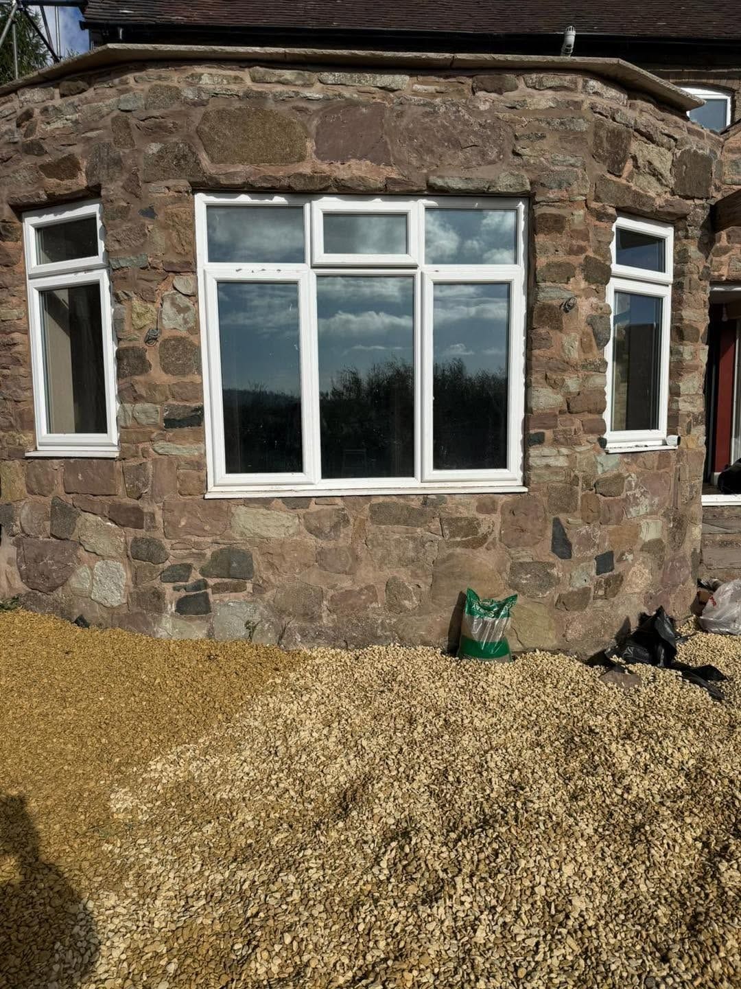 Sun room exterior, stone walls and windows, Ludlow