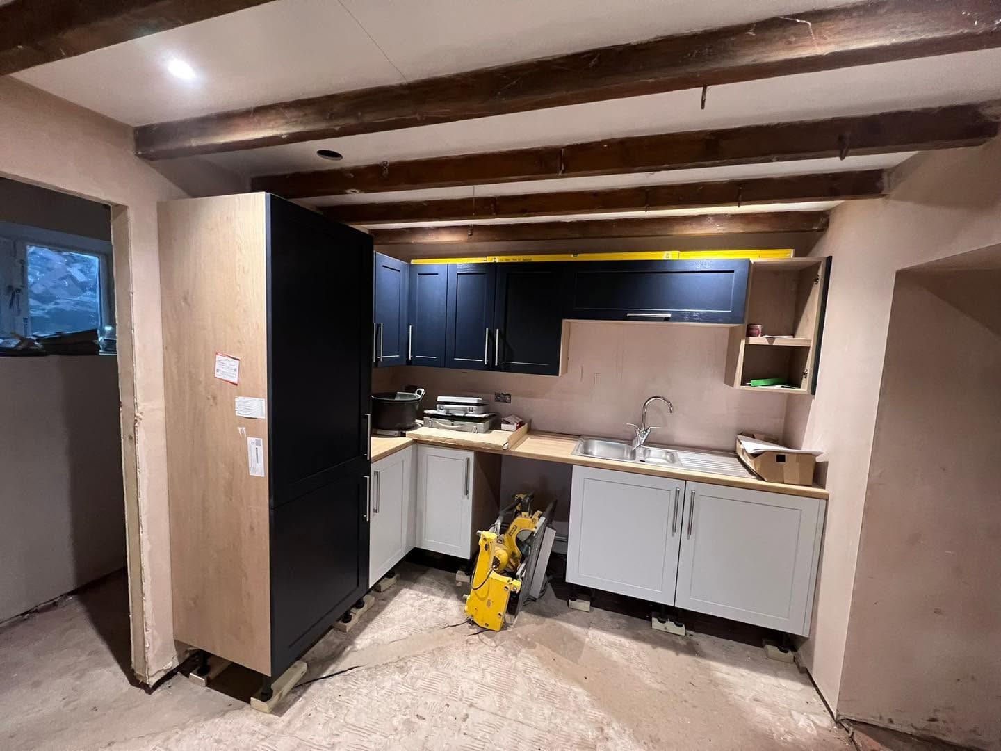 Kitchen units being fitted, Ludlow
