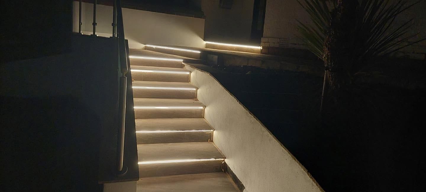 Lit steps and glass handrail
