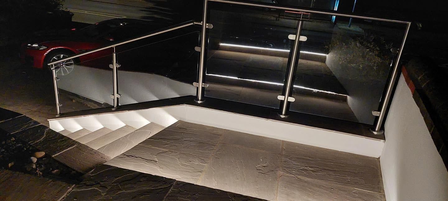 Glass handrail and lit steps from above