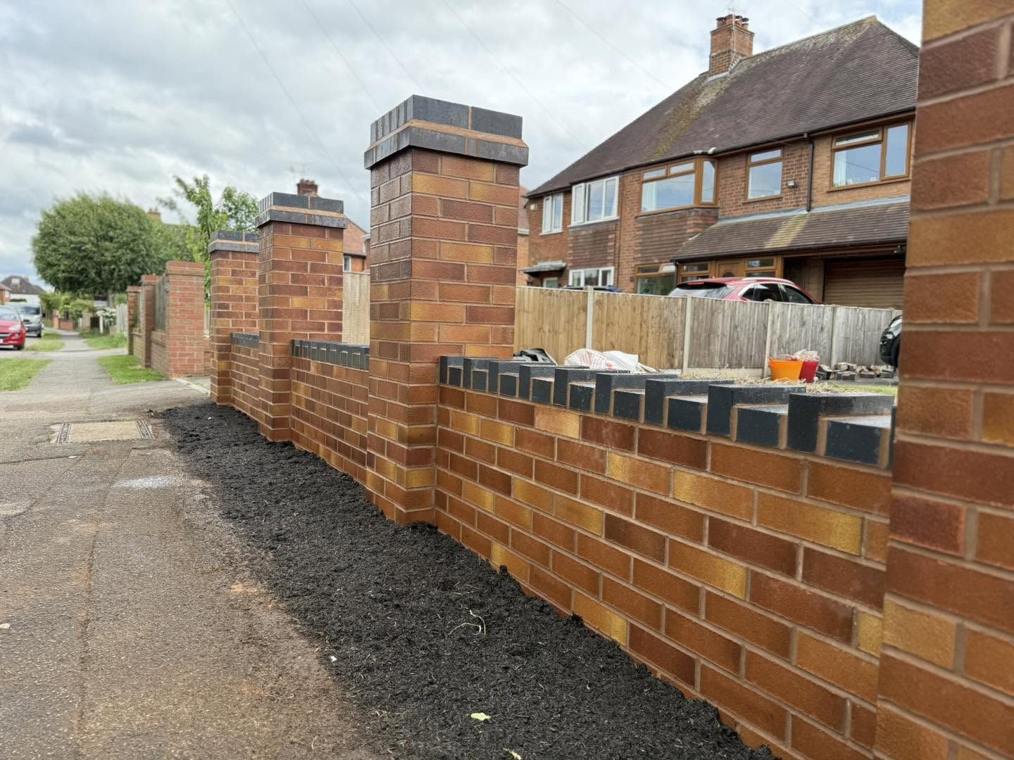 New brick wall with pillars and blue brick capping, Worcester